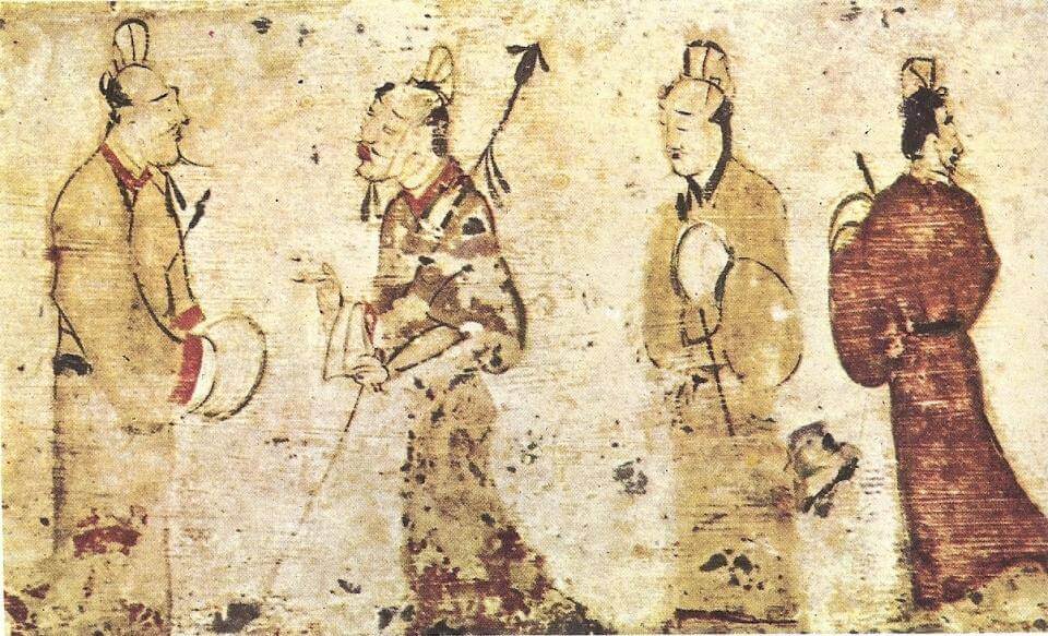 Two gentlemen engrossed in conversation while two others look on, a Chinese painting on a ceramic tile from a tomb near Luoyang, Henan province, dated to the Eastern Han Dynasty (25–220 AD)