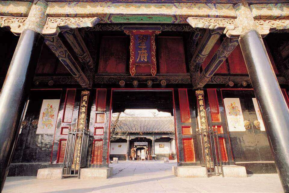 view through a gate at one of the courtyards of the Confucius Family Mansion in Qufu