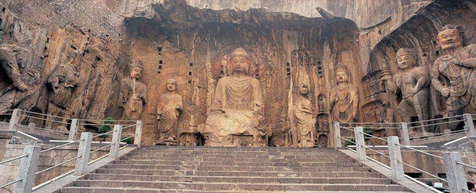 wide view of the 9 carved figures at the Fengxian Temple with the Vairocana Buddha at the center