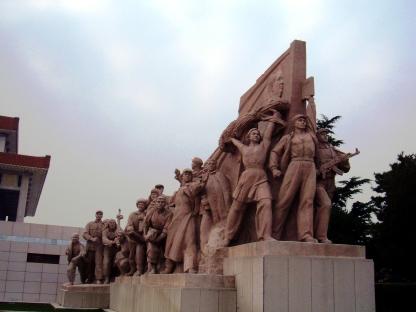group of revolutionary-themed clay figures depicting workers, peasants and soldiers on mausoleum's west side