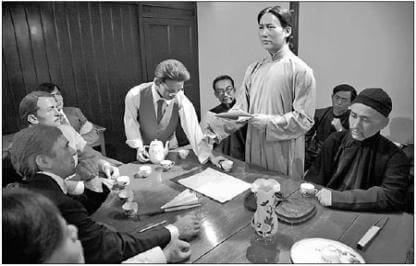 wax figures of Mao Zedong (standing center figure) and the other CPC delegates at the site of the party's First National Congress
