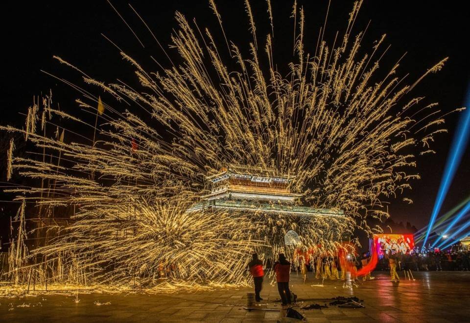 Chinese new year celebrations with traditional molten iron fireworks in front of Zhendong Gate in Shanhaiguan