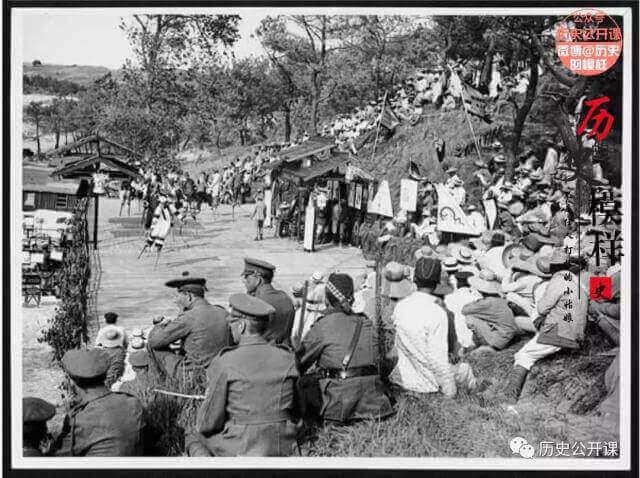 Members of the Chinese Labour Corps entertain British troops and Chinese workers at an open-air theatre at Etaples in 1918