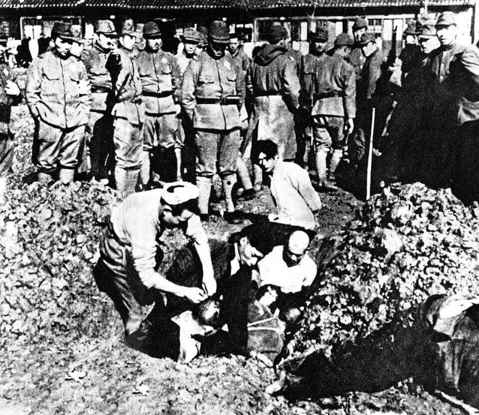 photo showing Japanese soldiers bury Chinese people alive during the Rape of Nanking (also known as the Nanjing Massacre)